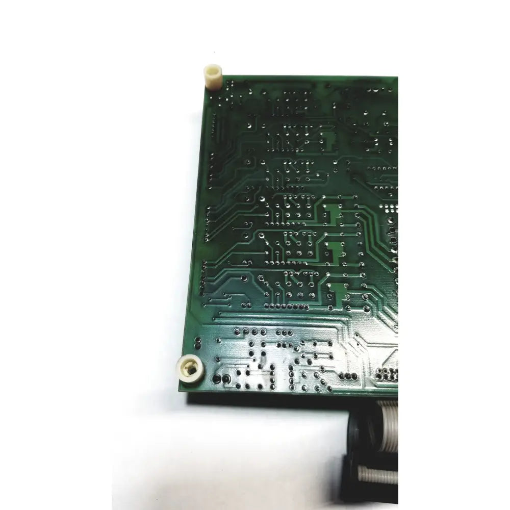 Green printed circuit board with intricate silver traces and solder points in 2p8414t mother board 2n3k2053-crdid-2053b