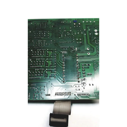 Green printed circuit board with silver soldered components and flexible ribbon cable connector on 2p8414t mother board