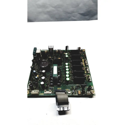 Green printed circuit board with black components white capacitors and a coiled gray cable on 2p8414t mother board