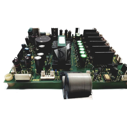 Green circuit board with black capacitors green cylindrical components and gray coiled cable of 2p8414t mother board