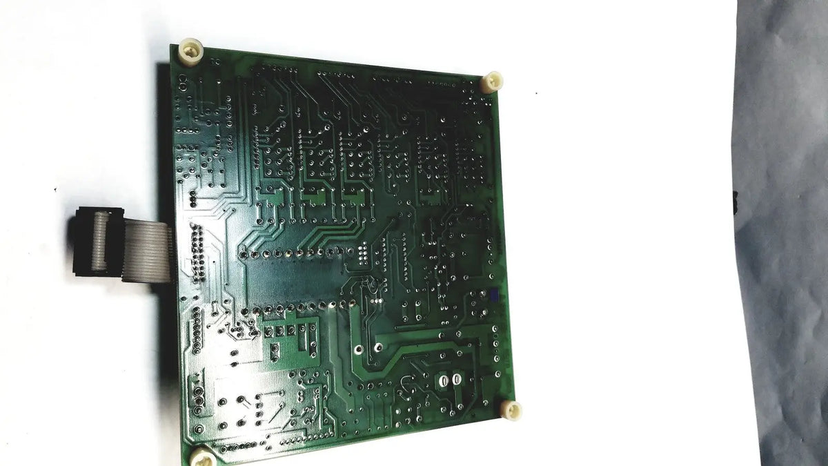 Green rectangular 2p8414t mother board with intricate copper traces and soldered components for electronic use