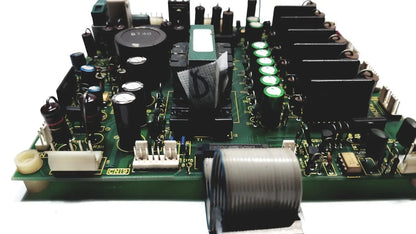 Green circuit board with black capacitors green cylindrical components and gray coiled cable of 2p8414t mother board