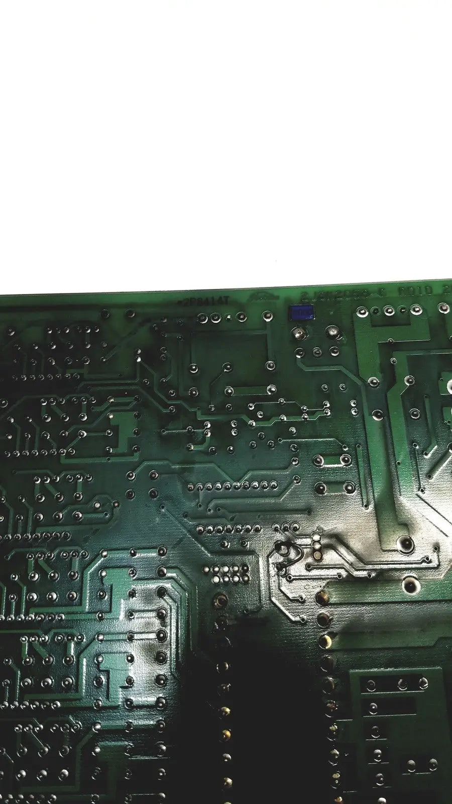 Green printed circuit board with silver conductive traces and soldered components for 2p8414t mother board model 2n3k2053-crdid-2053b