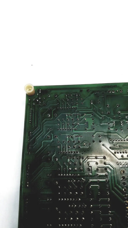 Green printed circuit board with intricate copper traces and solder pads of 2p8414t mother board model 2n3k2053-crdid-2053b
