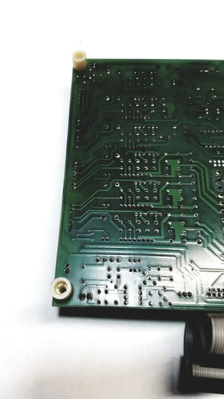 Green printed circuit board with intricate silver traces and solder points in 2p8414t mother board 2n3k2053-crdid-2053b