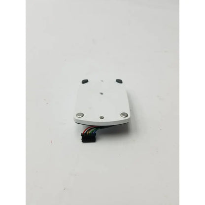 White rectangular lithium battery pack module with silver screws and multicolored ribbon cable for accu-chek inform ii