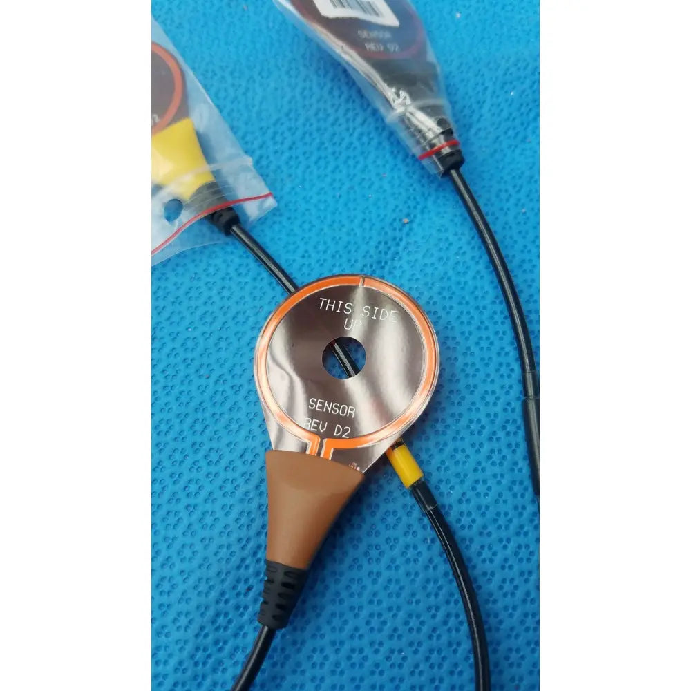 Circular metallic 3 leads snap sensor asm-0128-04 with orange trim black cables and brown connector for lbl-0307-01 recorder