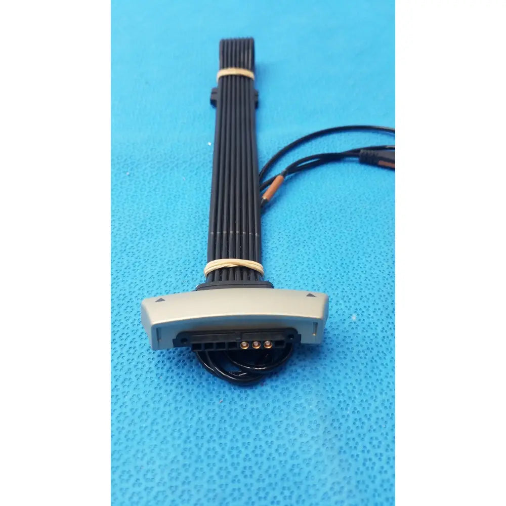 Gray plastic leads snap asm-0128-04 connector with black ribbed cable bundled by beige ties for lbl-0307-01 recorder