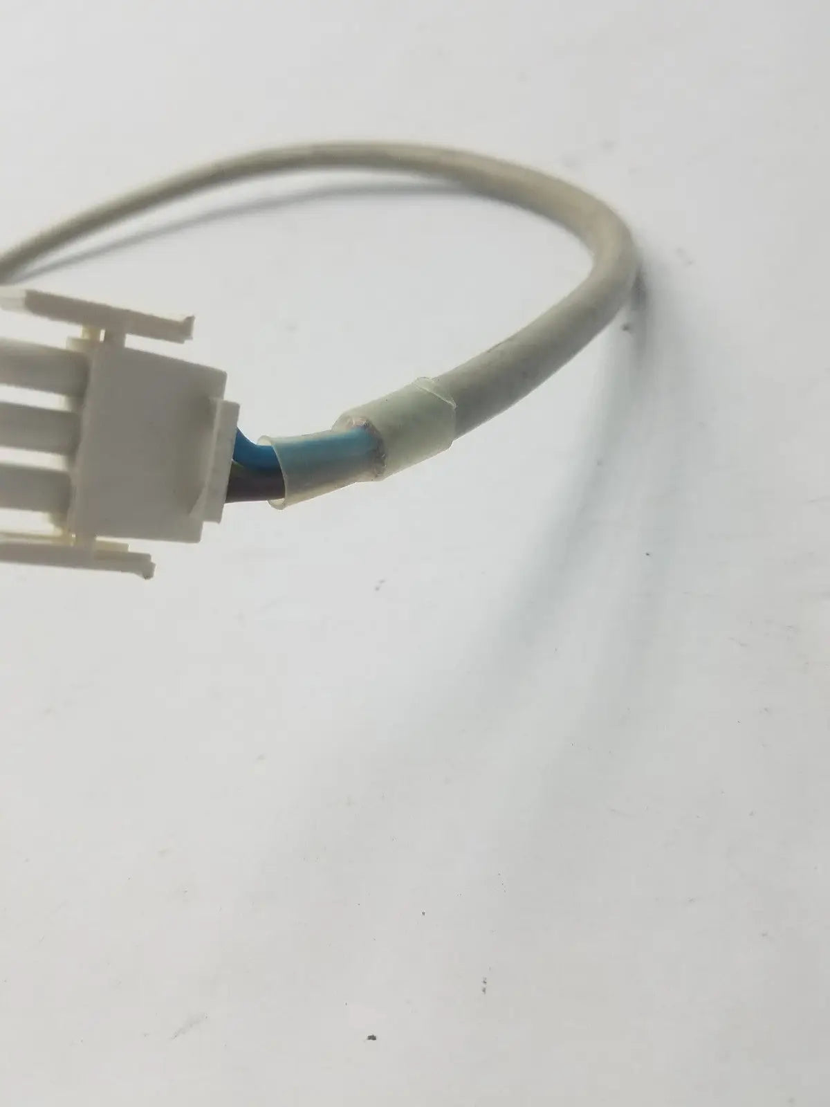 Gray plastic-coated 3-pin female cable with white multi-pin connector and blue internal wires for adapter use