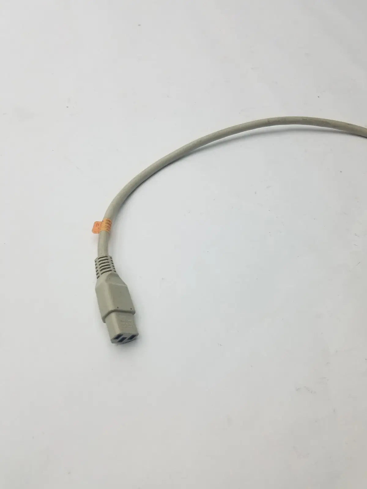 Gray 3-pin female cable with three-pronged plug and orange tie near connector for adapter connection