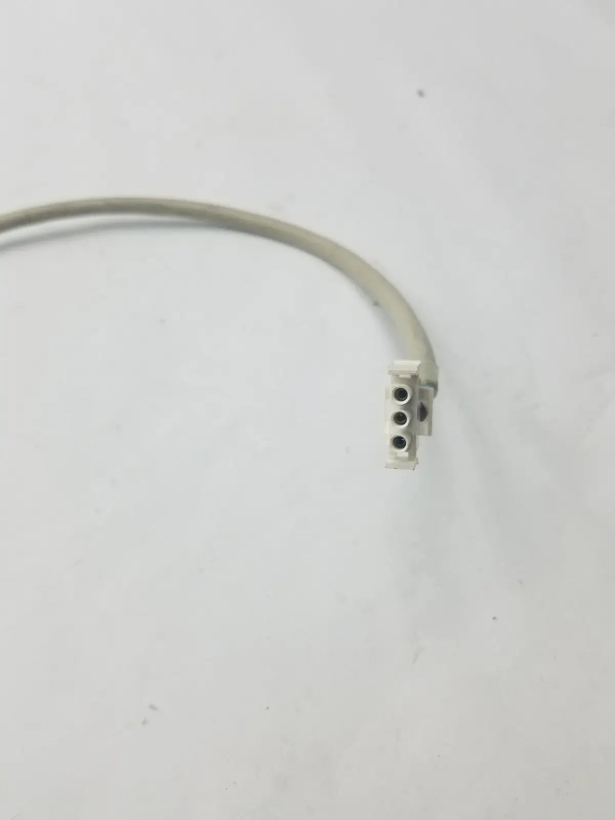 Gray 3-pin female cable with white plastic connector featuring four circular holes for adapter connection