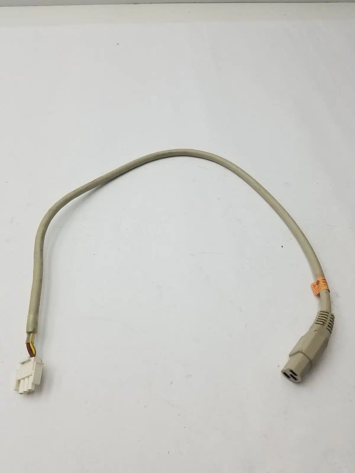 Beige 3 pin female adapter cable with white connector and gray ribbed plug for secure electrical connections