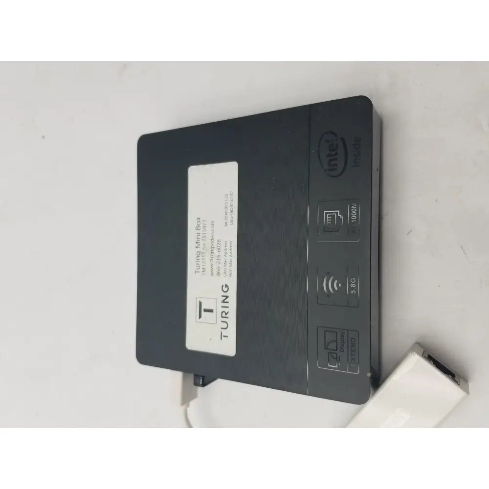 Black turing mini box with intel n3060e processor 5g connectivity and matte finish shown with 3 pin female connector cable