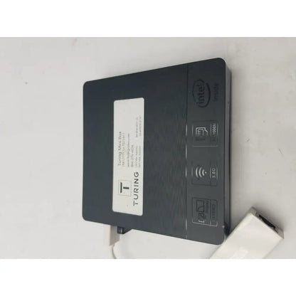 Black turing mini box with intel n3060e processor 5g connectivity and matte finish shown with 3 pin female connector cable