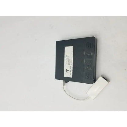 Black turing mini pc with intel branding and white usb adapter connected to a 3 pin female connector cable