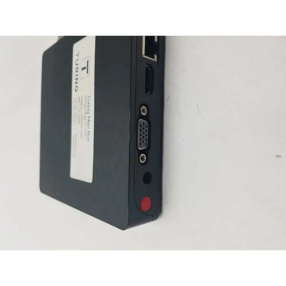 Black turing mini box with matte finish showing back side ports including pin female connector cable interfaces