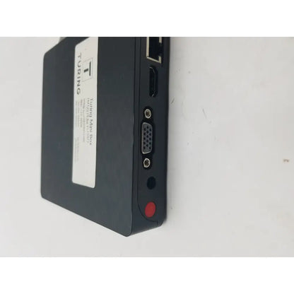 Black turing mini box with matte finish showing back side ports including pin female connector cable interfaces
