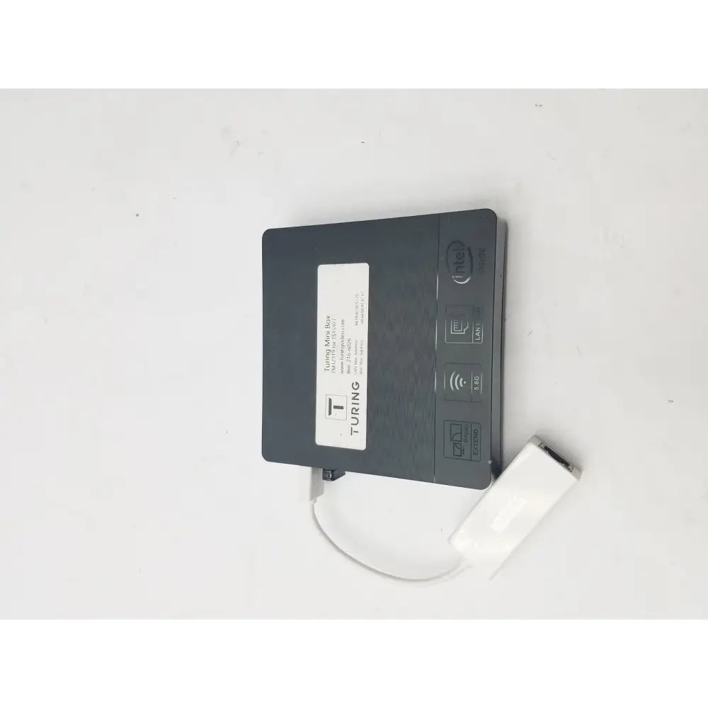 Black turing 4g lte mobile hotspot with white usb cable attached featuring 3 pin female connector cable connection