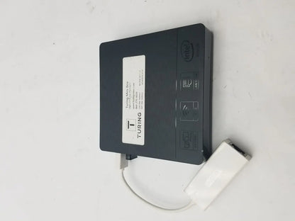 Black turing mini box with intel badge and white 3 pin female connector cable attached for secure connections