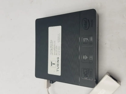 Black turing mini box with intel n3060e processor 5g connectivity and matte finish shown with 3 pin female connector cable