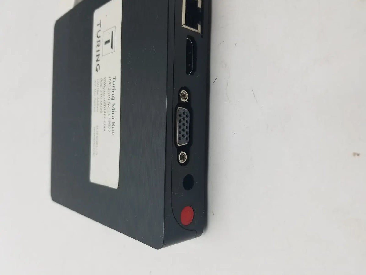 Black turing mini box with matte finish showing back side ports including pin female connector cable interfaces