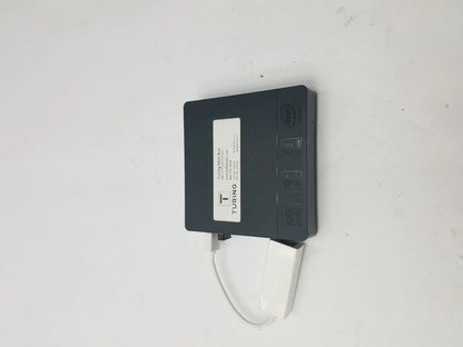 Black turing mini box with white 3 pin female connector cable attached featuring intel branding and sleek design