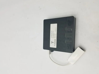 Black turing mini pc with intel branding and white usb adapter connected to a 3 pin female connector cable