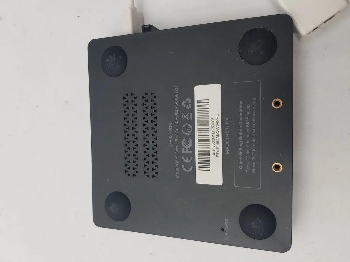 Black rectangular 3 pin female connector cable device with circular feet and ventilation grille shown from back side