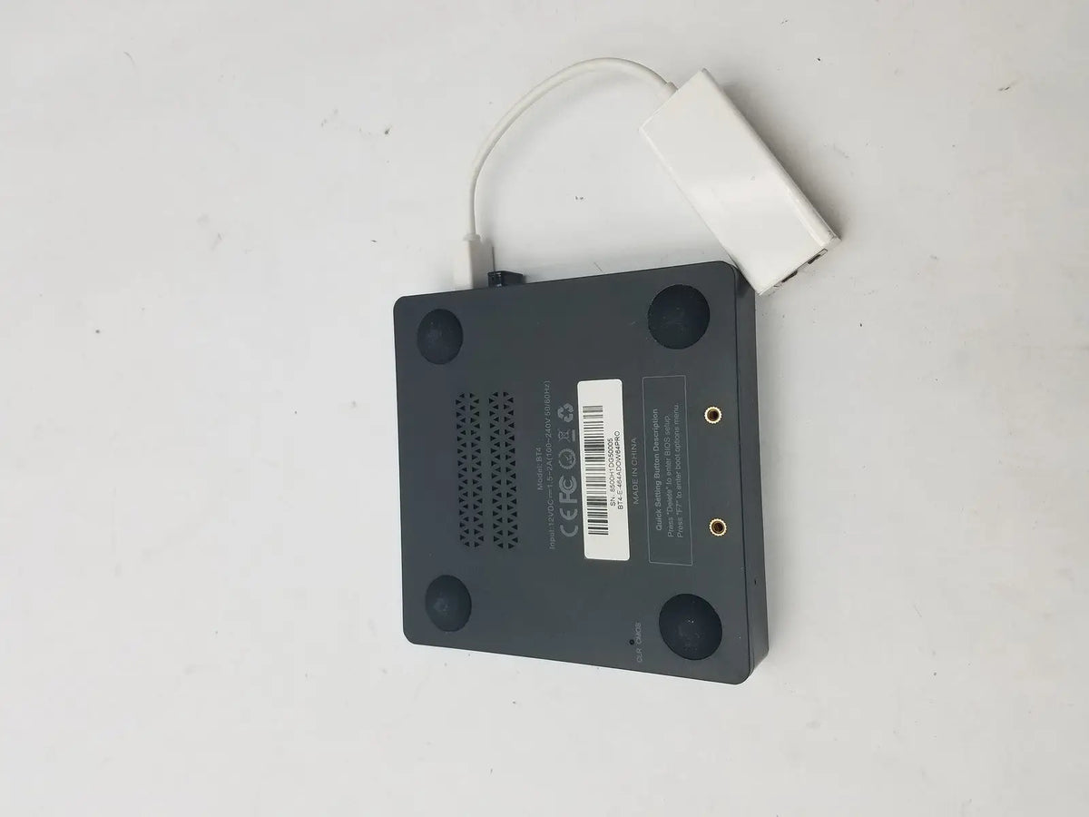 Black rectangular media player with white usb adapter attached by a 3 pin female connector cable for data transfer