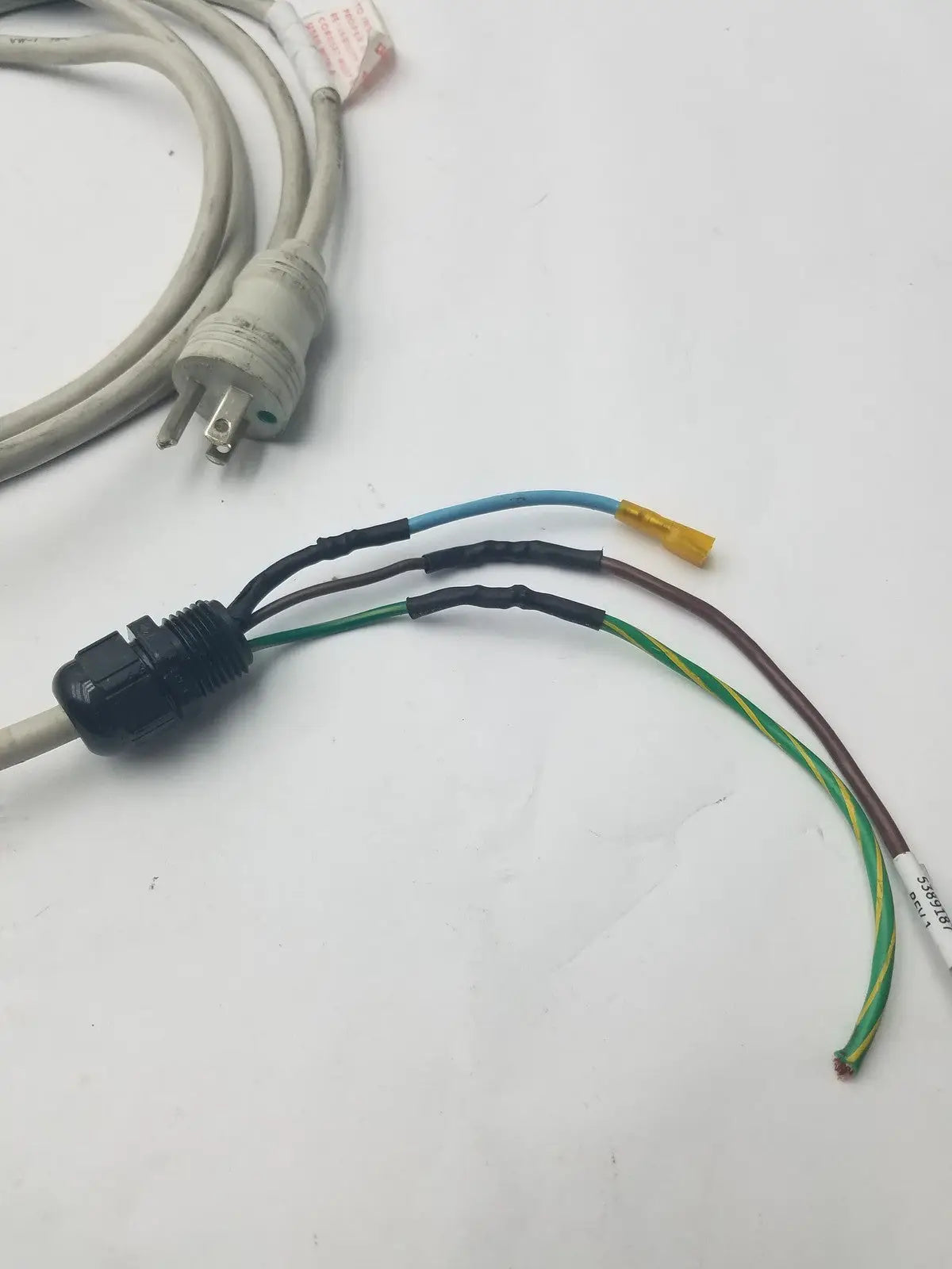 Black plastic 3 prong power cable wire connector harness with multiple colored wires for electrical connections