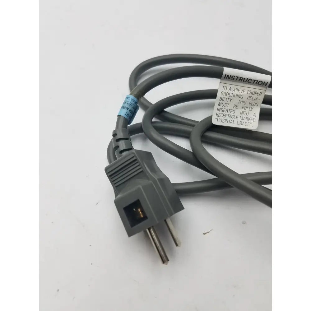 Gray 3 prong power cord detachable cable with instructional label and durable insulated material for secure connections