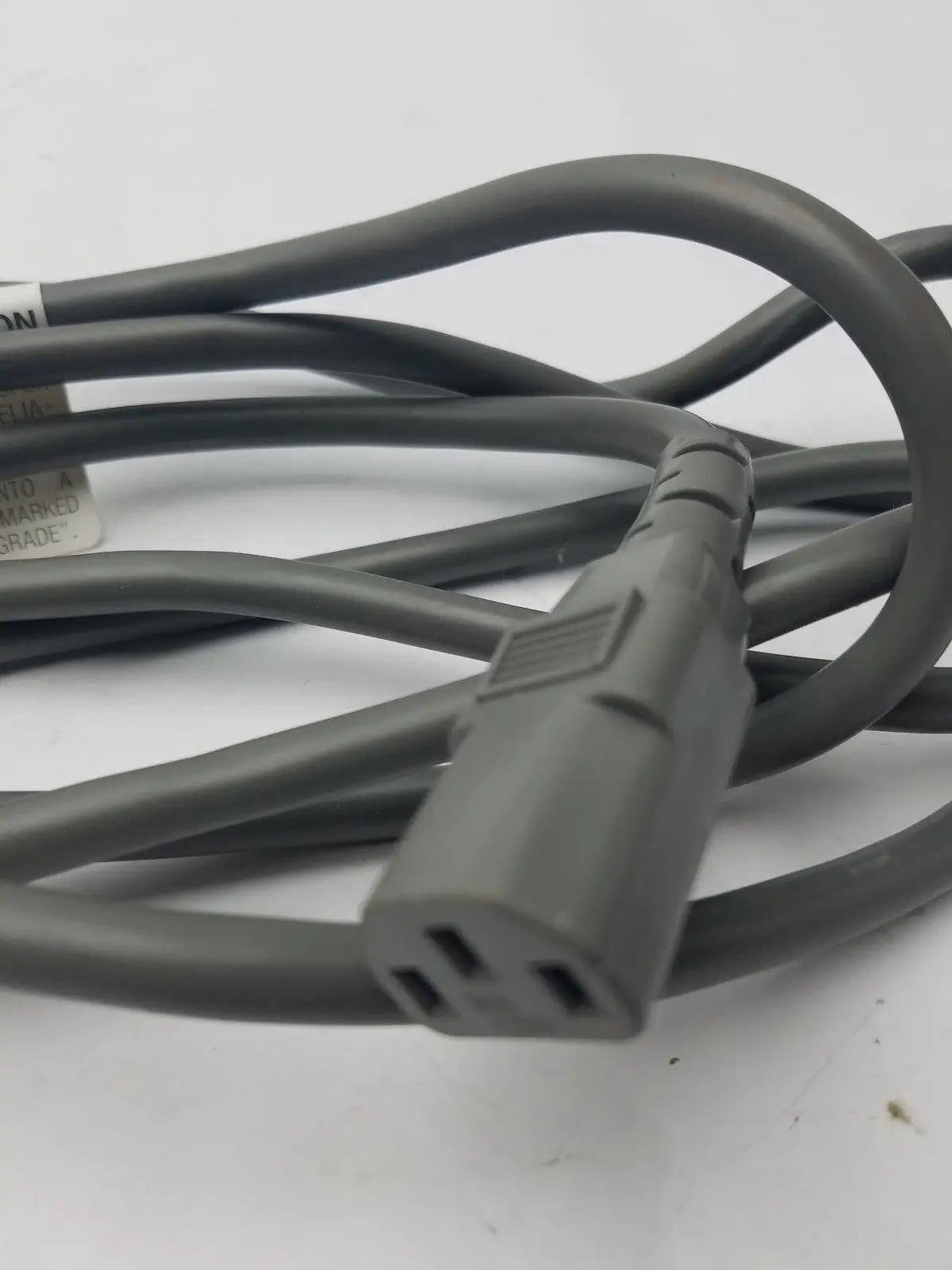 Gray power cord detachable cable with three-pronged plug and molded plastic connectors for secure electrical connection