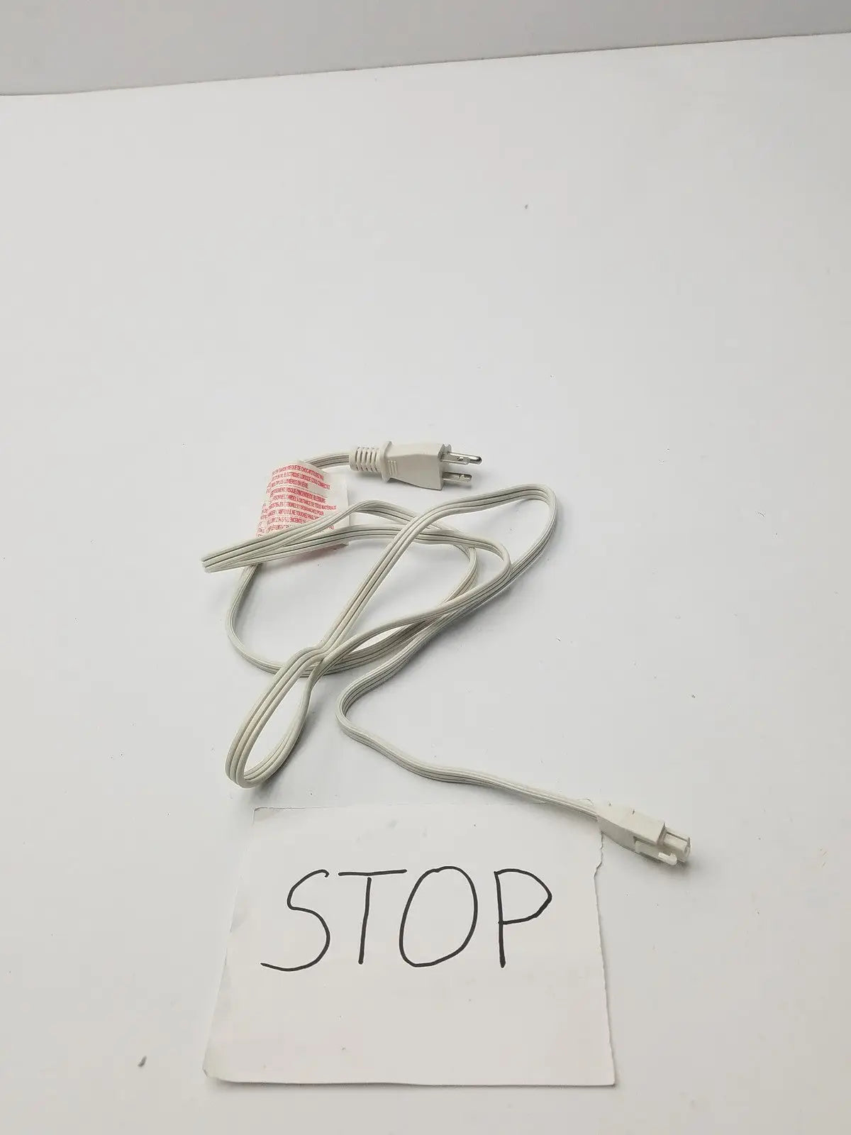 White power extension cord with two-prong plug and red warning label for 3 prong to 3 pin female connector use