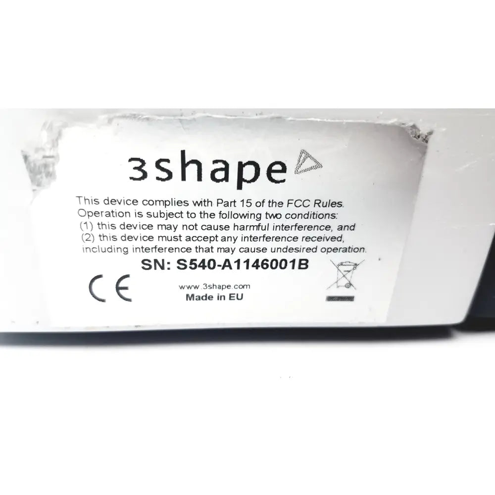 White rectangular label with black text and 3shape logo on the back of the calibration kit a1146001b showing fcc and ce marks