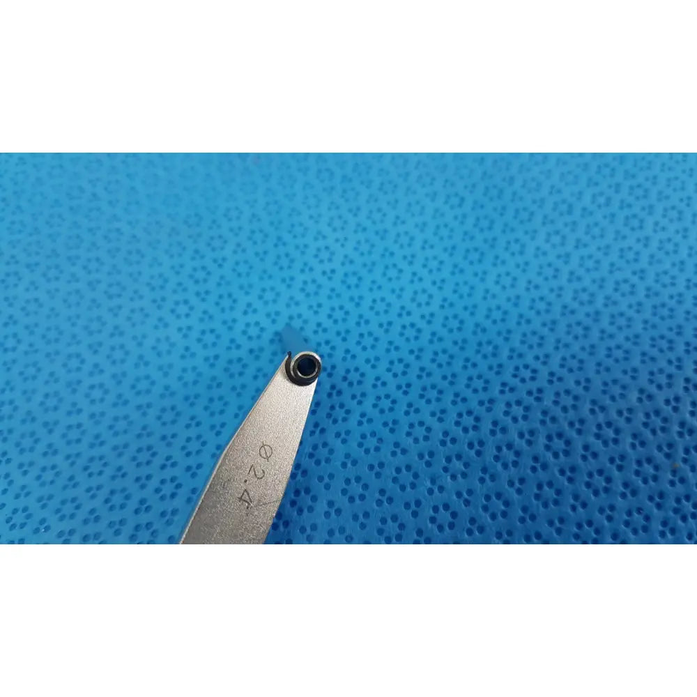 Silver metal surgical orthopedic drill depth gauge with pointed tip and engraved markings for precise drill depth measurement