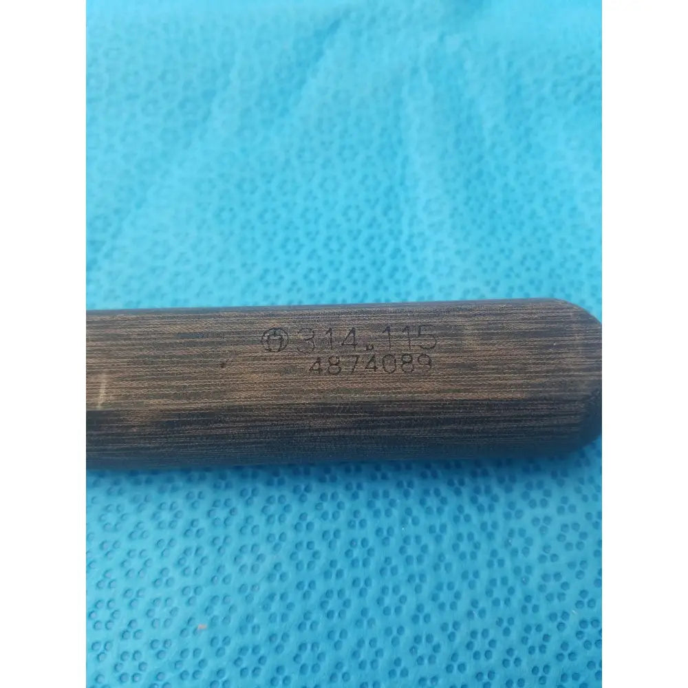 Dark brown wooden handle with engraved markings on hex screwdriver stainless surgical instrument stainless steel
