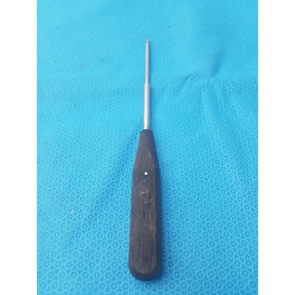 Dark wooden-handled surgical instrument with slender metallic shaft hex screwdriver stainless steel for precision use