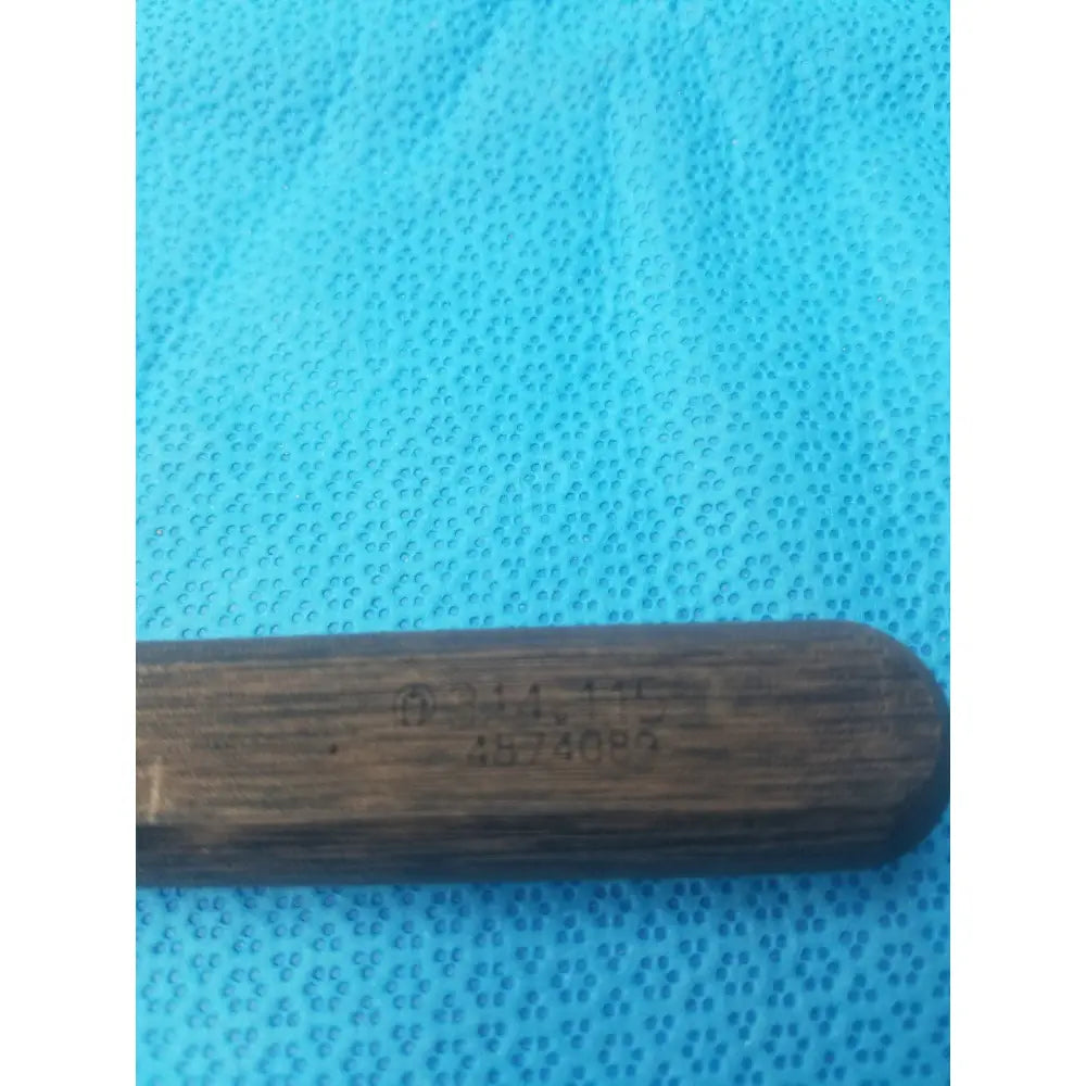 Dark brown wooden handle with engraved markings on hex screwdriver stainless steel surgical instrument model 314.115
