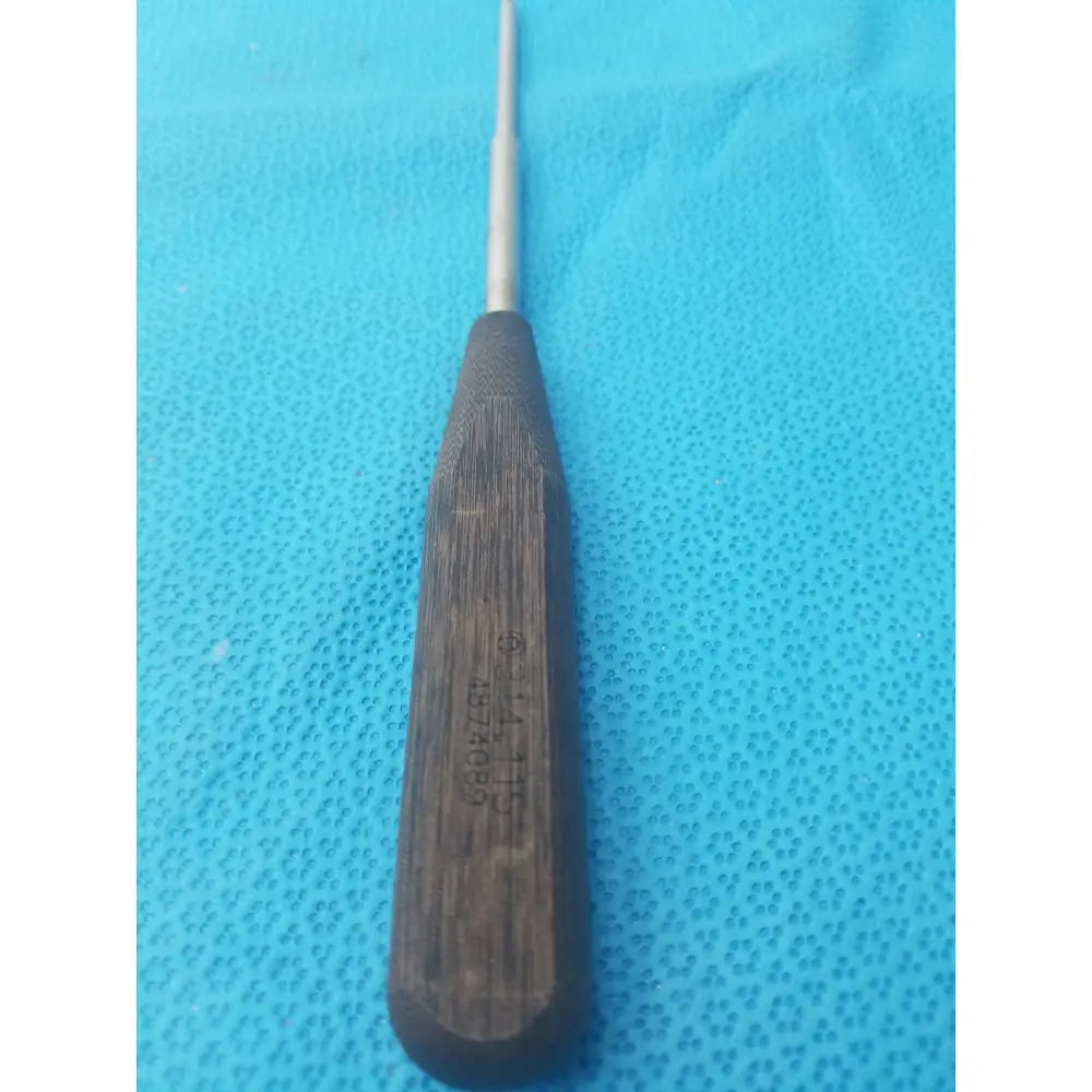 Dark wood-handled hex screwdriver stainless steel surgical instrument with slender metallic shaft for precise use