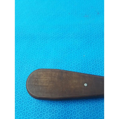 Dark brown wooden handle hex screwdriver stainless steel surgical instrument with carved roll illustration and white dot