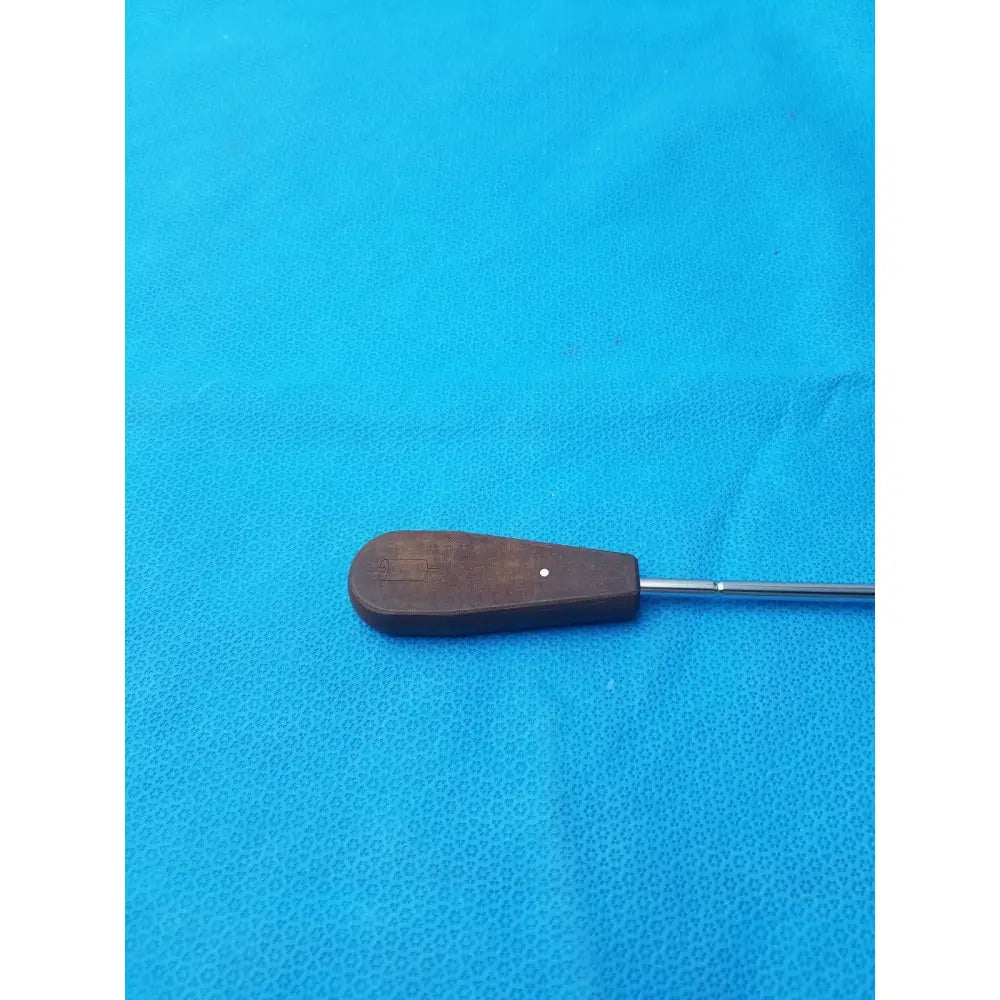 Brown wooden-handled hex screwdriver stainless steel surgical instrument with metallic shaft for precision use