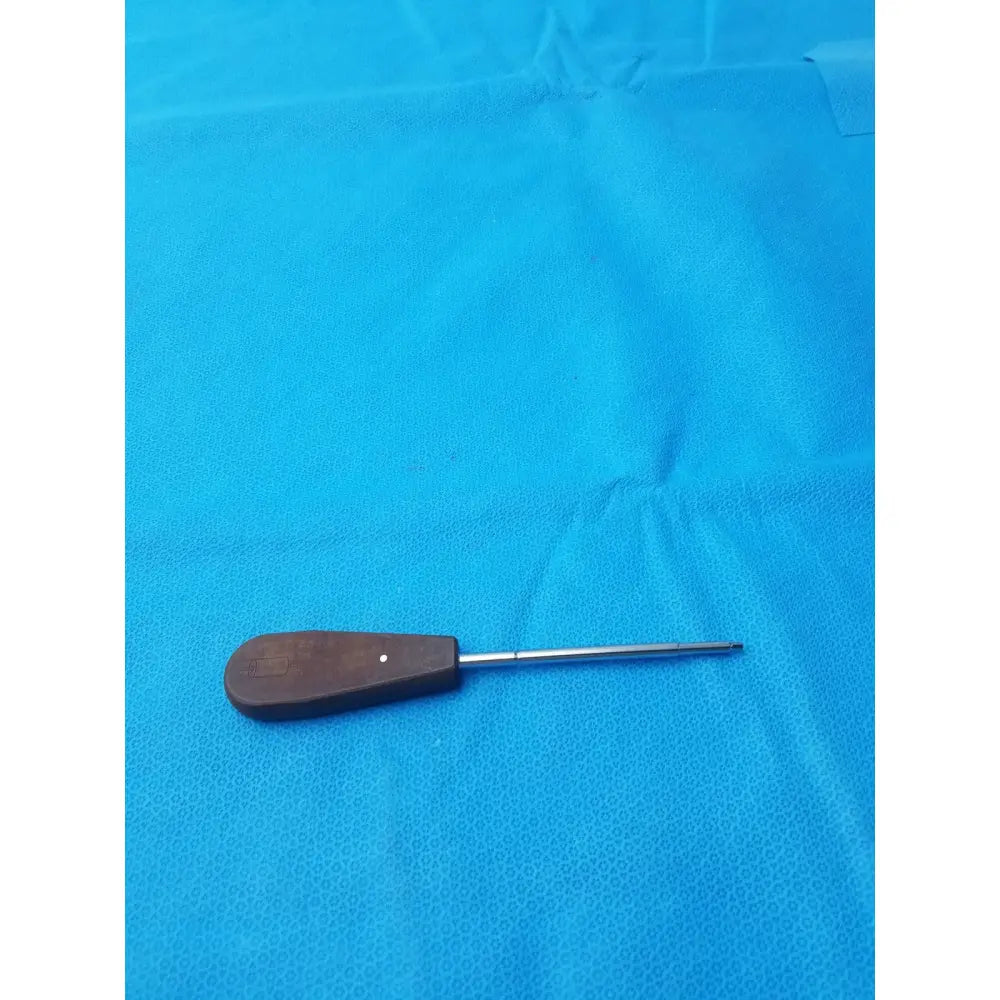 Dark brown wooden-handled hex screwdriver stainless steel surgical instrument with slender metallic shaft for precision use