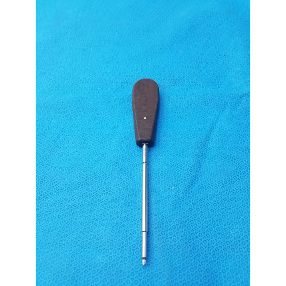 Brown-handled hex screwdriver stainless steel surgical instrument with metallic shaft for medical use