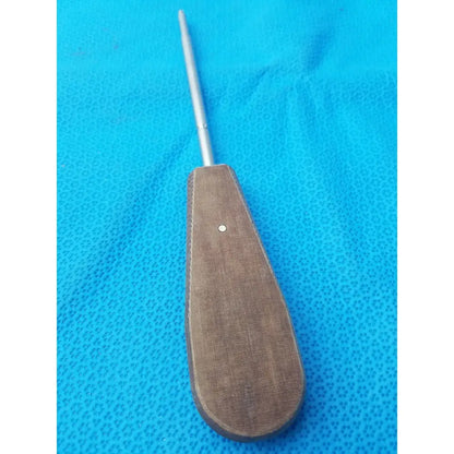 Brown textured handle surgical instrument with slender metallic shaft hex screwdriver stainless steel for precision use