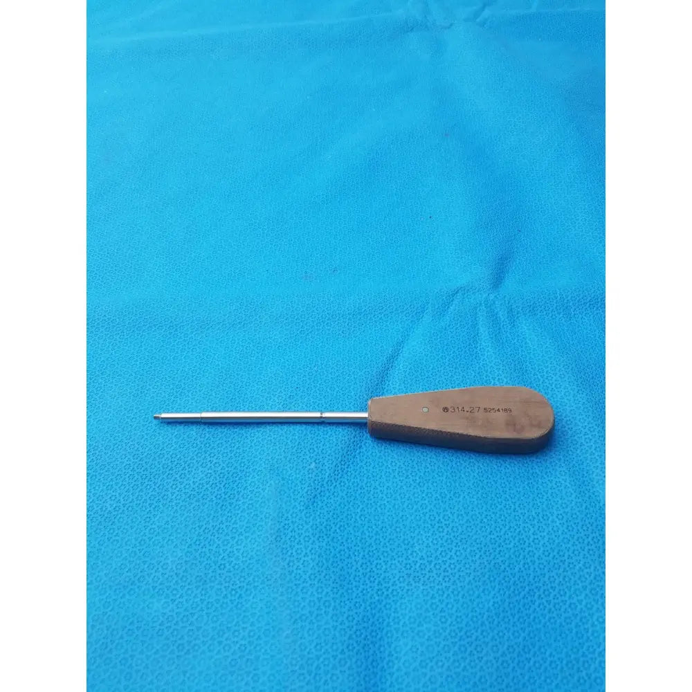 Wooden-handled surgical instrument hex screwdriver stainless steel with slender metallic shaft and engraved markings