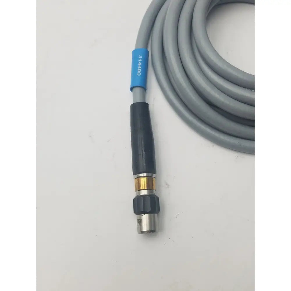 Gray high-pressure washer hose with black brass nozzle and blue label marked 314890 for fiber optic light guide cable use