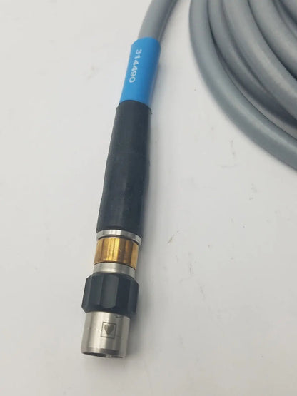 Gray and black high-pressure fiber optic light guide cable hose with blue label marked 314490 near the connector