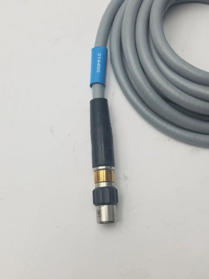 Gray high-pressure washer hose with black brass nozzle and blue label marked 314890 for fiber optic light guide cable use
