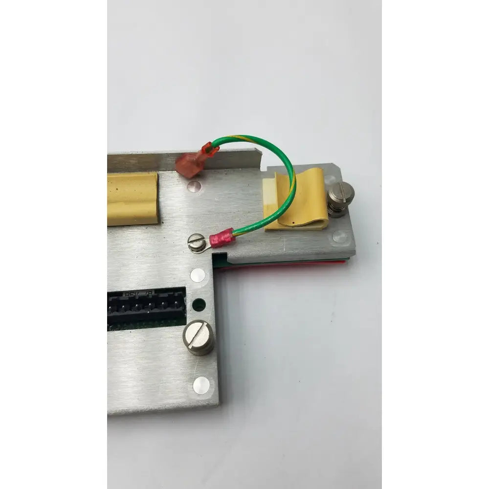 Silver metallic electrical component with green and red wires on the back of rev 7b black 35421222a rev black keyboard
