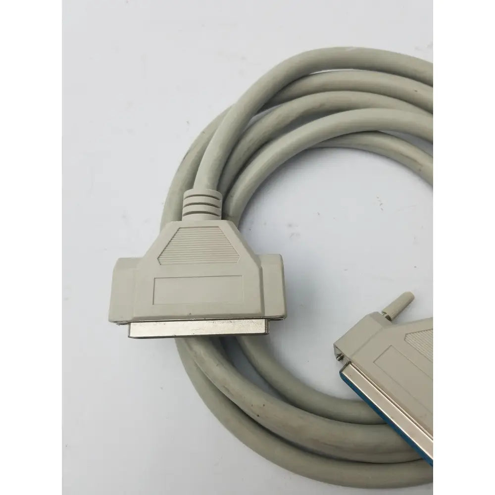 Gray coiled 36-pin centronics to 25-pin db25 lpt cord printer cable with beige connectors and metallic contacts